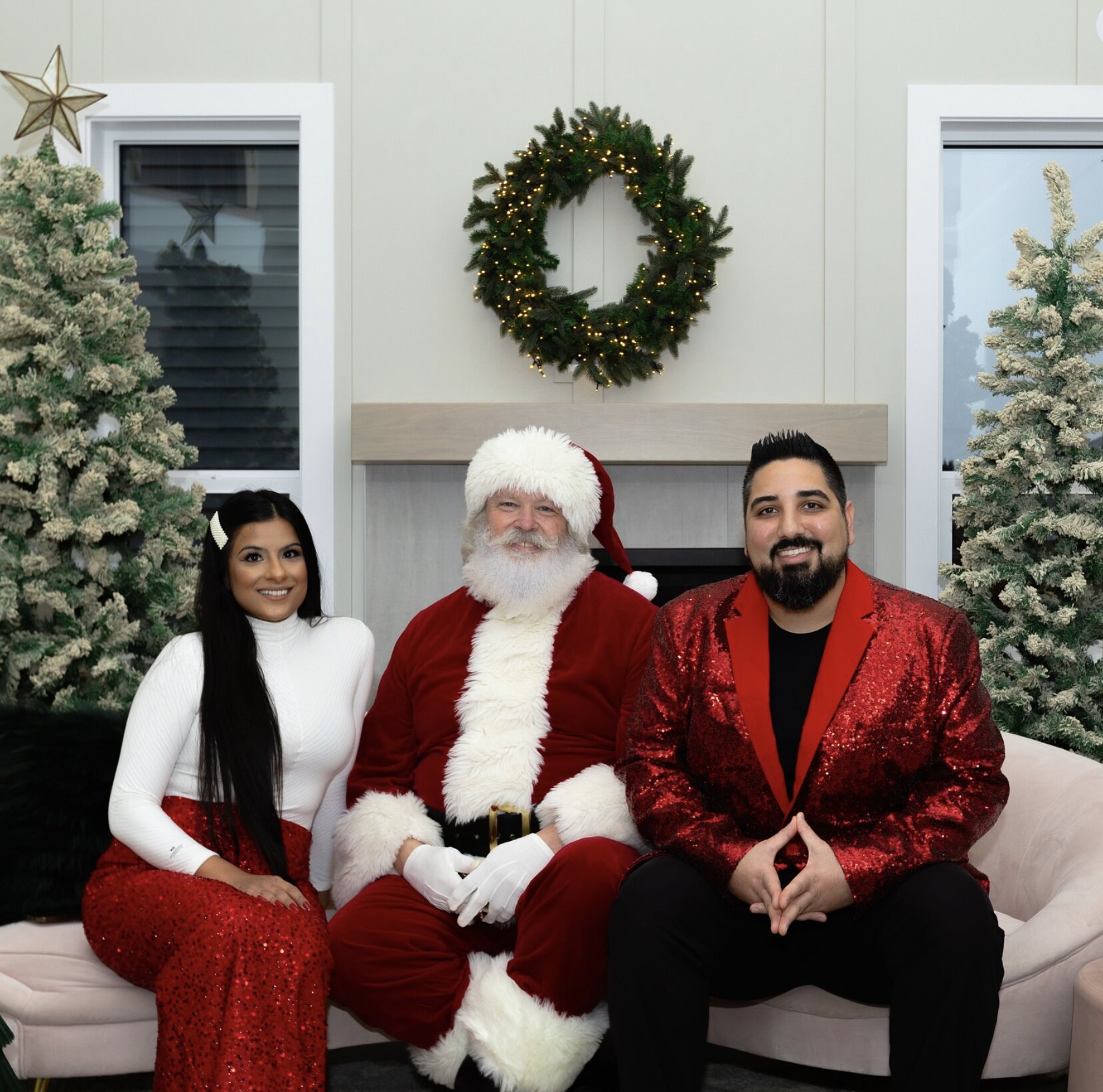 Dawar and Sheri Zada with Santa at the Zada Group holiday event