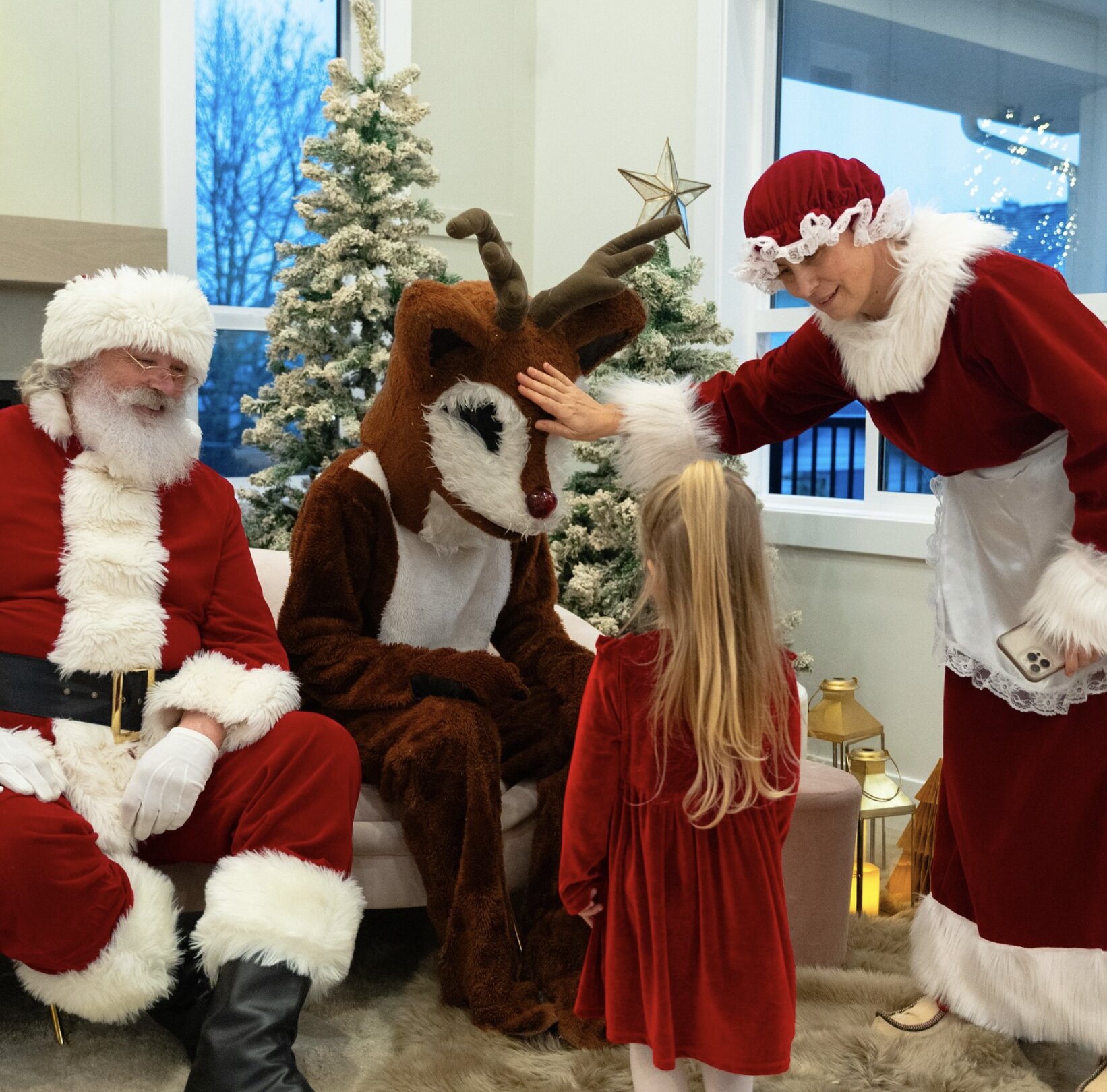 Photos with Santa, Mrs. Claus, and Rudolph for Zada Group clients and their families